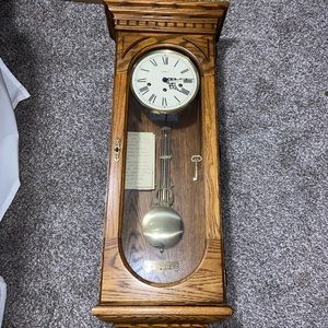 Howard Miller Westmont wall clock #613-110 walnut w oak Yorkshire finish